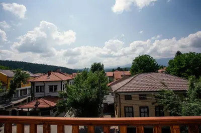 a view from the balcony of a town with houses at Guest house Legeto in Samokov