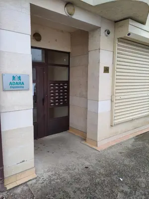 a building with a door and a sign on it at Mladost 1 Apartment near the metro in Sofia