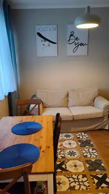 a living room with a couch and a table at Dolce Vita-Sofia Apartment in Sofia