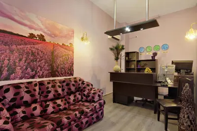 a living room with a couch and a piano at Family Hotel Marsina in Sofia