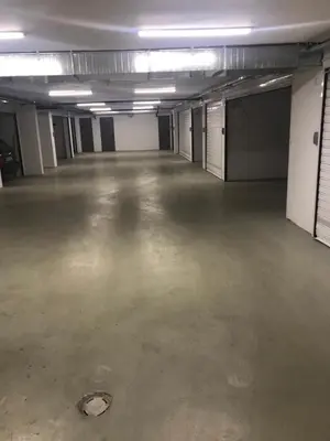an empty parking garage with a large empty room at Kapana Luxury City Center Apartments with Garage in Plovdiv
