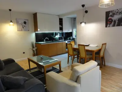 a living room with a couch and a table at Apartment Sofia Center 2 in Sofia
