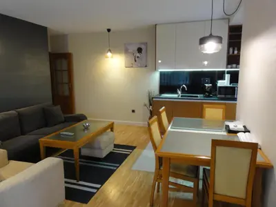 a living room with a couch and a table at Apartment Sofia Center 2 in Sofia