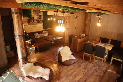 an overhead view of a restaurant with a living room at Roots Apartment in Borovets