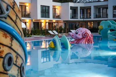 a swimming pool with a pool noodle in a hotel at Medite Spa Resort and Villas in Sandanski