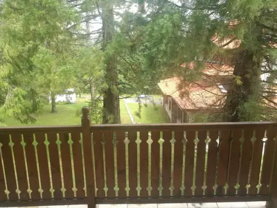 a balcony with a view of a yard at Borovets Mountain Apartment Sequoia in Borovets