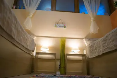 a room with two lights on the wall and two windows at 4 Seasons apartments, A1 in Plovdiv