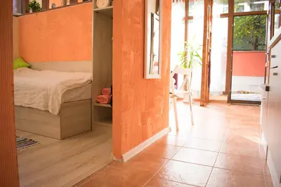 a bedroom with a bed and a tiled floor at 4 Seasons apartments, A1 in Plovdiv