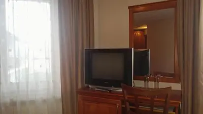 a television sitting on a dresser in a room at Bella Vista Guesthouse in Bansko