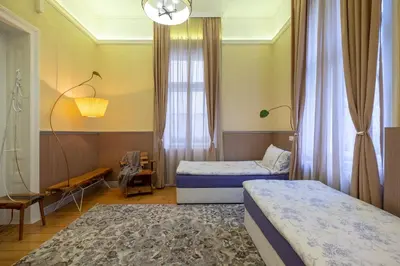 a hotel room with two beds and a window at Temptation in Sofia - 24h Self Check-in in Sofia