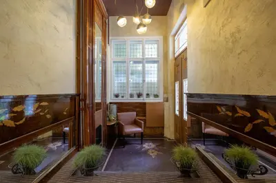 a hallway with a table and chairs and a window at Temptation in Sofia - 24h Self Check-in in Sofia