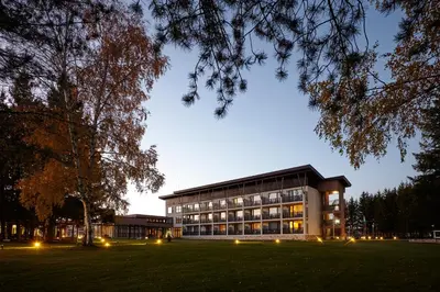 a large building with lights in front of it at Belchin Garden SPA&Wellness in Belchin