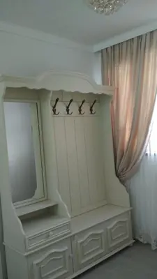 a shelf with ducks on it next to a window at Ikonomov House in Bansko
