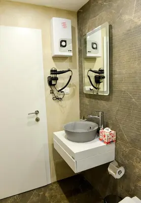 a bathroom with a sink and a mirror at Boutique Apartments Blagoevgrad in Blagoevgrad