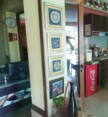 a door in a kitchen with paintings on it at Hotel Trakart Residence in Plovdiv