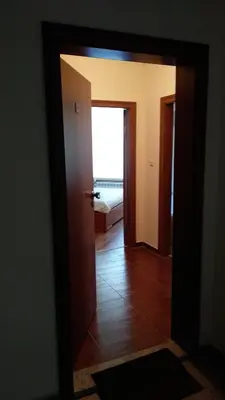 a hallway with a door open to a room at Ski Apartment D50 Cedar Lodge 4 in Bansko