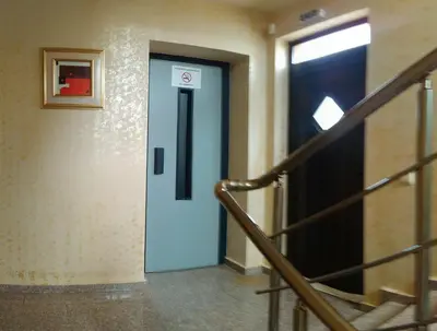 a blue door with a no smoking sign in a building at City Blagoevgrad Family Hotel in Blagoevgrad
