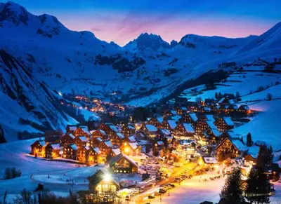 a small town in the mountains at night at Borovets Gondola Apartment & Ski by Winter Bros in Borovets