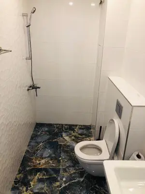 a bathroom with a toilet and a sink at Bluemarine Apartment in Sofia