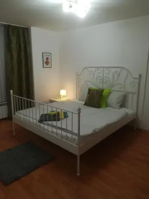 a bedroom with a crib with green pillows at Sofia Peak in Sofia