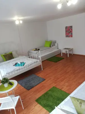 a living room with a couch and a table at Sofia Peak in Sofia