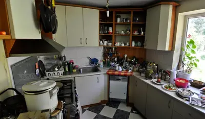 a small kitchen with a sink and a stove at Strandzhata's House in Pasarel