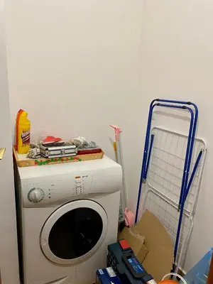 a washing machine in a room with a mop at Aparthotel - Monastery 3, 1 Bedroom Apartment in Pamporovo
