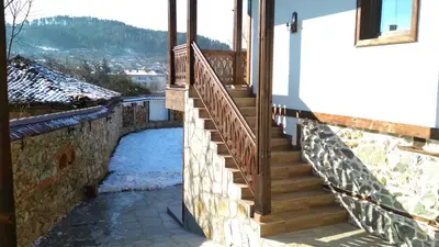 a set of stairs leading up to a house at Боримечковата къща in Kalofer
