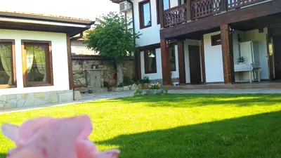 a flower in the yard of a house at Боримечковата къща in Kalofer