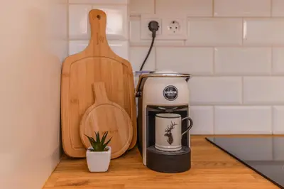a kitchen counter with a coffee maker and a toaster at cО́coEllie - Aesthetic 2BD Apt Near National Palace by Flat Mаnager in Sofia