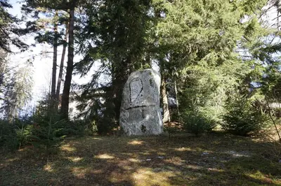 a stone monument in the middle of a forest at Hotel Borovets Edelweiss in Borovets