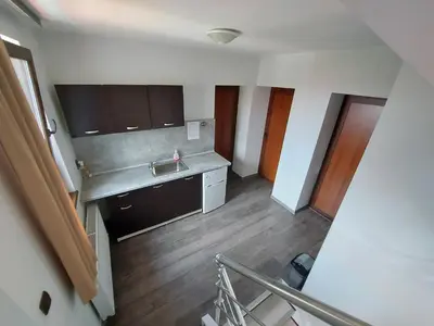 a kitchen with a sink and a counter top at Sharkova House Bansko in Bansko