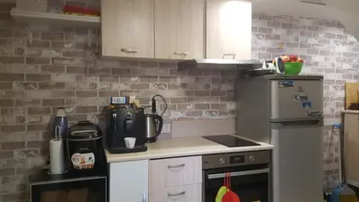a kitchen with a stove and a refrigerator at Sharkova House Bansko in Bansko