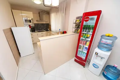 a kitchen with a red refrigerator in a room at Villa Drecheva in Ognyanovo