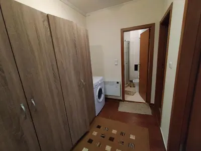 a bathroom with a washing machine and a washer and dryer at Pine Tree Apartment 3 - B3 in Bansko