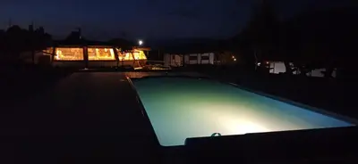 an empty swimming pool in the dark at night at Debeli Dab in Stara Kresna