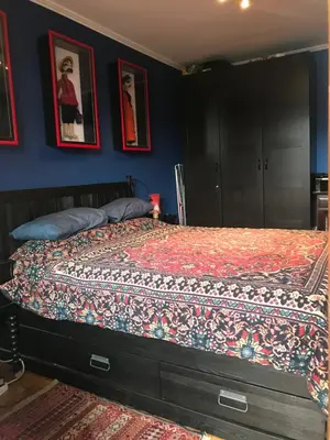 a bedroom with a bed with a quilt on it at Gondola Flat Number 5 in Bansko