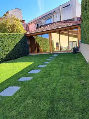 a garden with a walkway in front of a house at Guest House Ideal in Sapareva Banya