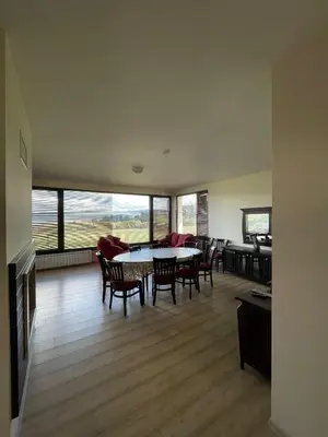 a large living room with a table and chairs at VILLA RELAX in Tsigov Chark