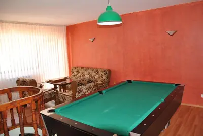 a living room with a pool table in it at Family Hotel Shoky in Chepelare