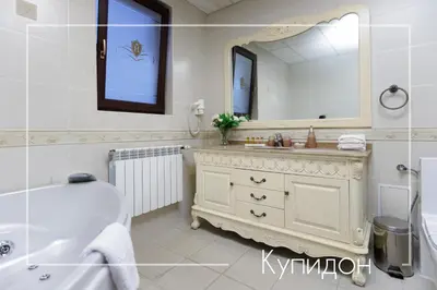 a bathroom with a tub and a sink and a mirror at Boutique & Spa Hotel Heaven in Velingrad
