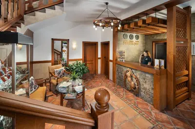 a woman taking a picture of a restaurant lobby at Boutique Complex Trakiets in Zhitnitsa