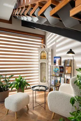 a living room with two chairs and a table at Boutique Complex Trakiets in Zhitnitsa