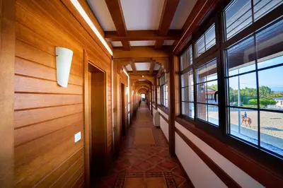 a hallway of a building with windows and a hallwayngth at Boutique Complex Trakiets in Zhitnitsa