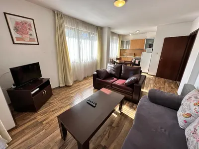 a living room with a couch and a table at Ramada 2 - Apartment in Bansko