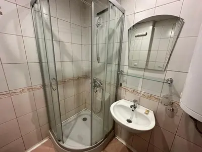 a bathroom with a shower and a sink at Ramada 2 - Apartment in Bansko