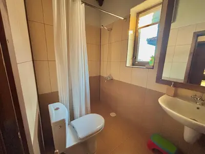 a bathroom with a toilet and a sink at Villa Bachevo Horizon in Bachevo
