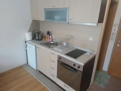a small kitchen with a sink and a stove at Studio L006 in Aspen Golf in Bansko
