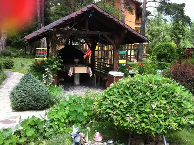 a garden with a small pavilion in a garden at Vila Kalvachevi in Tsigov Chark