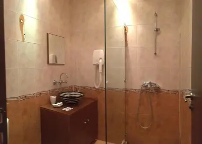 a bathroom with a shower with a glass door at Villa Mark in Kraevo